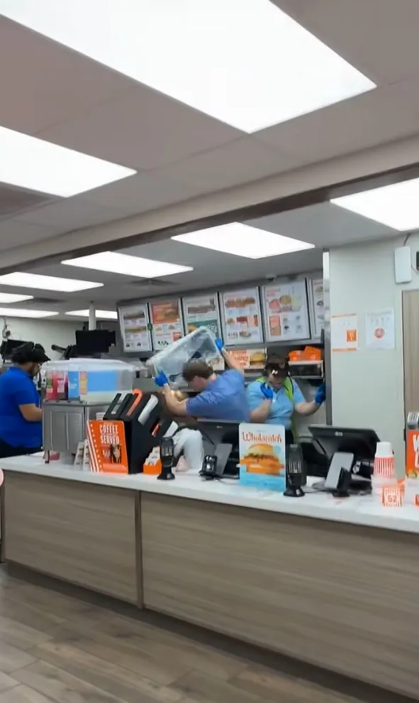 The suspect allegedly came back looking for trouble, throwing punches at the manager before the fast-food worker fought back.