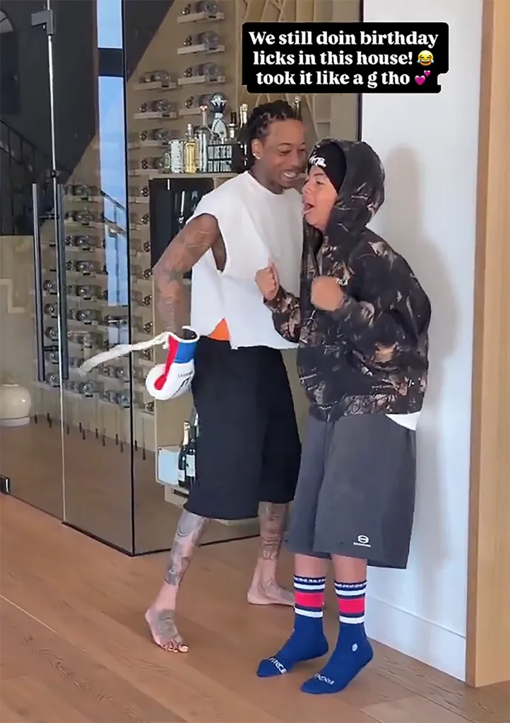 Wiz Khalifa gives his son 13 birthday punches while wearing boxing gloves.