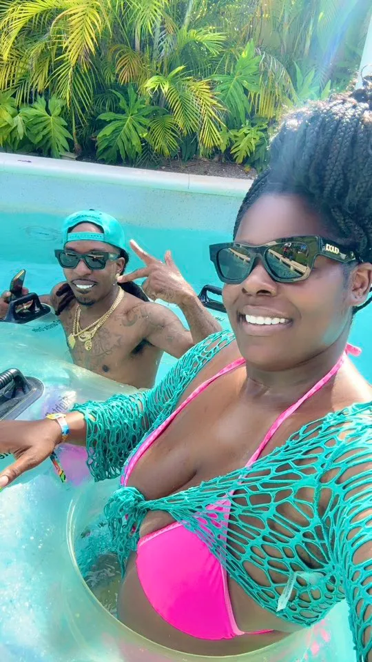 A man and woman in an inner tube in a lazy river.