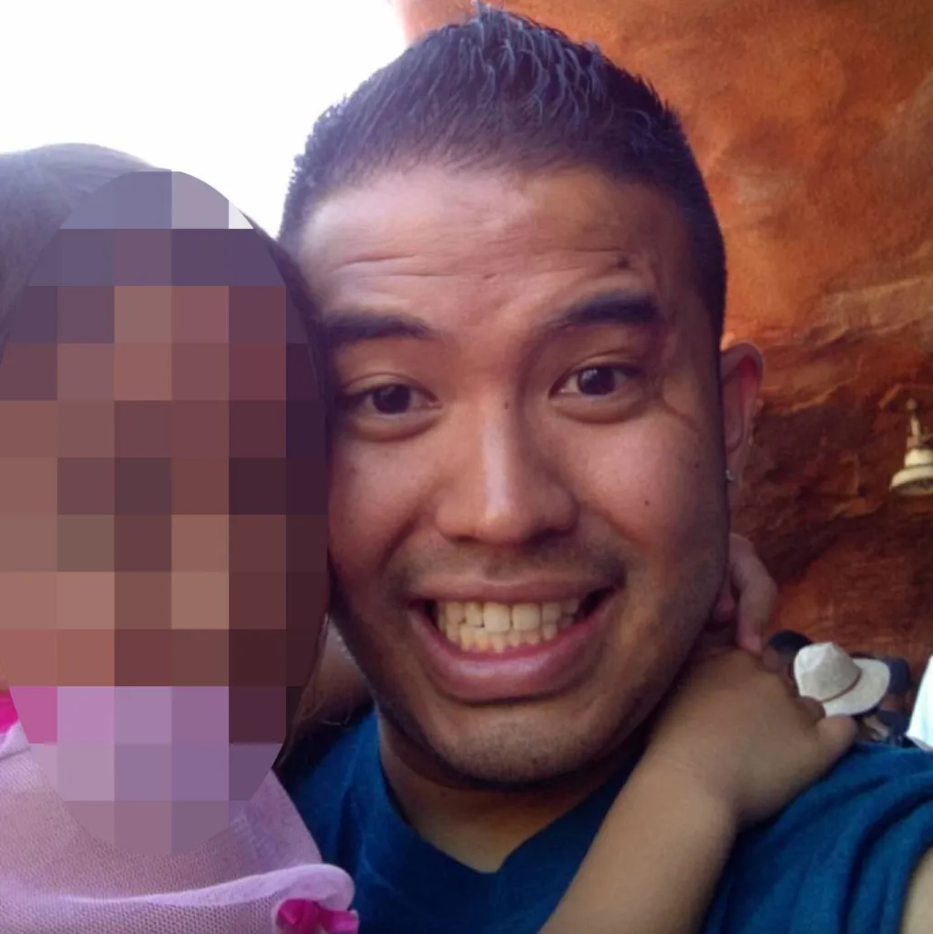 A man with spiky hair and a pixelated face of a child.