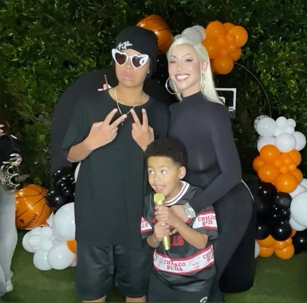 Amber Rose posing with her two sons.
