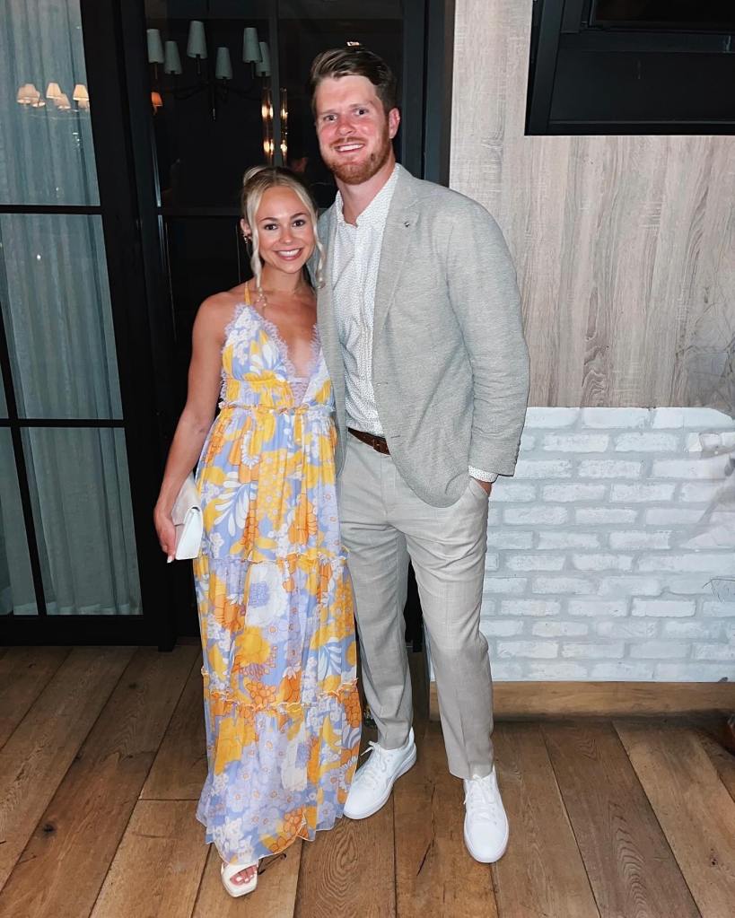 Katie Hoofnagle and Sam Darnold posing for a photo.