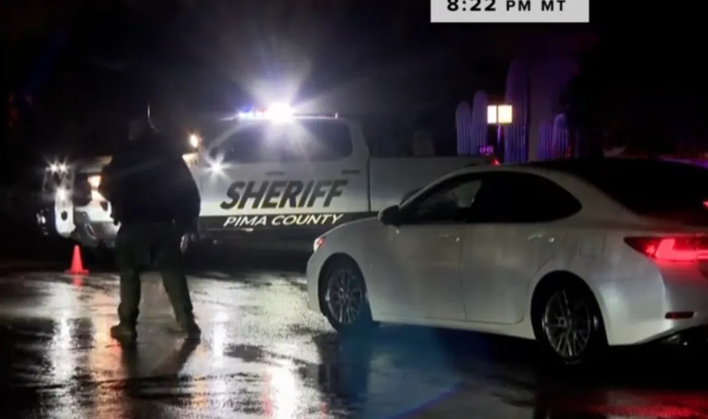 A Pima County Sheriff's vehicle blocks the road leading to a home where a SWAT operation unfolded on Feb. 13, 2026.