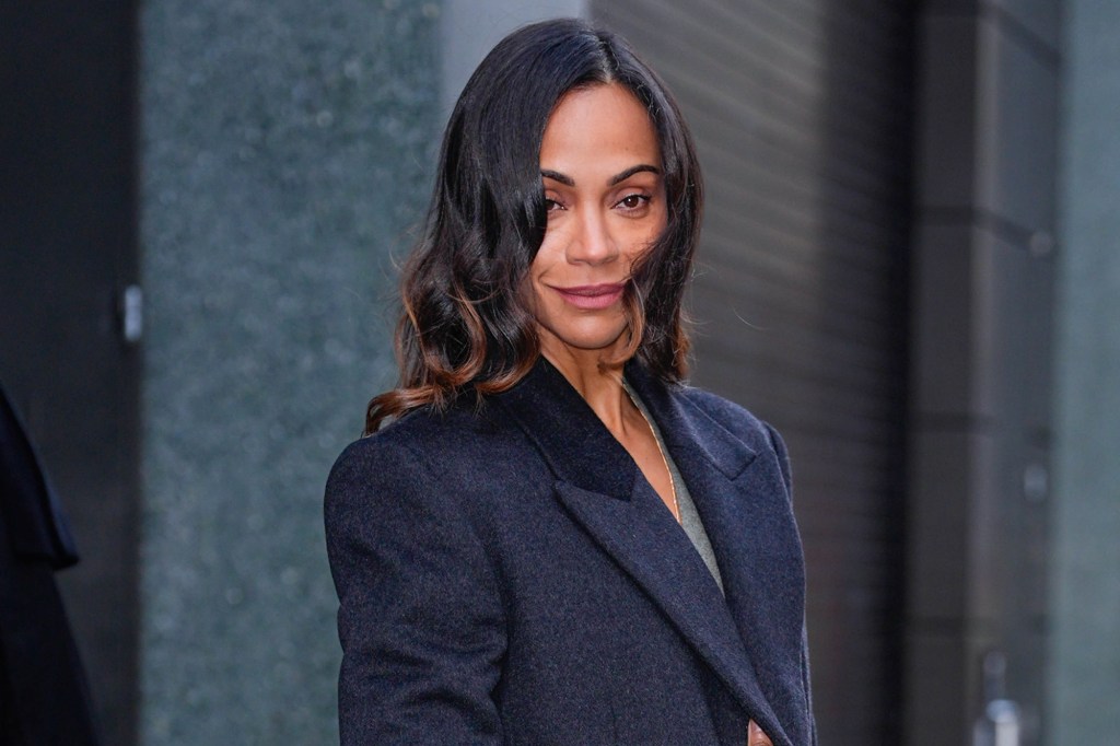 Zoe Saldana seen wearing a dark navy coat.