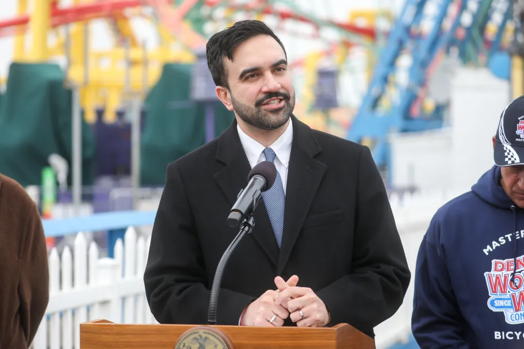 NYC Mayor Zohran Mamdani speaking at a press conference at Deno's Wonder Wheel Amusement Park.