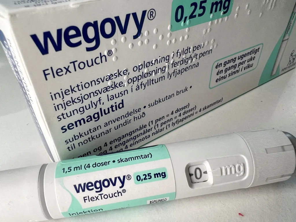 Illustration of a Novo Nordisk Wegovy 0.25 mg injection pen with its packaging.