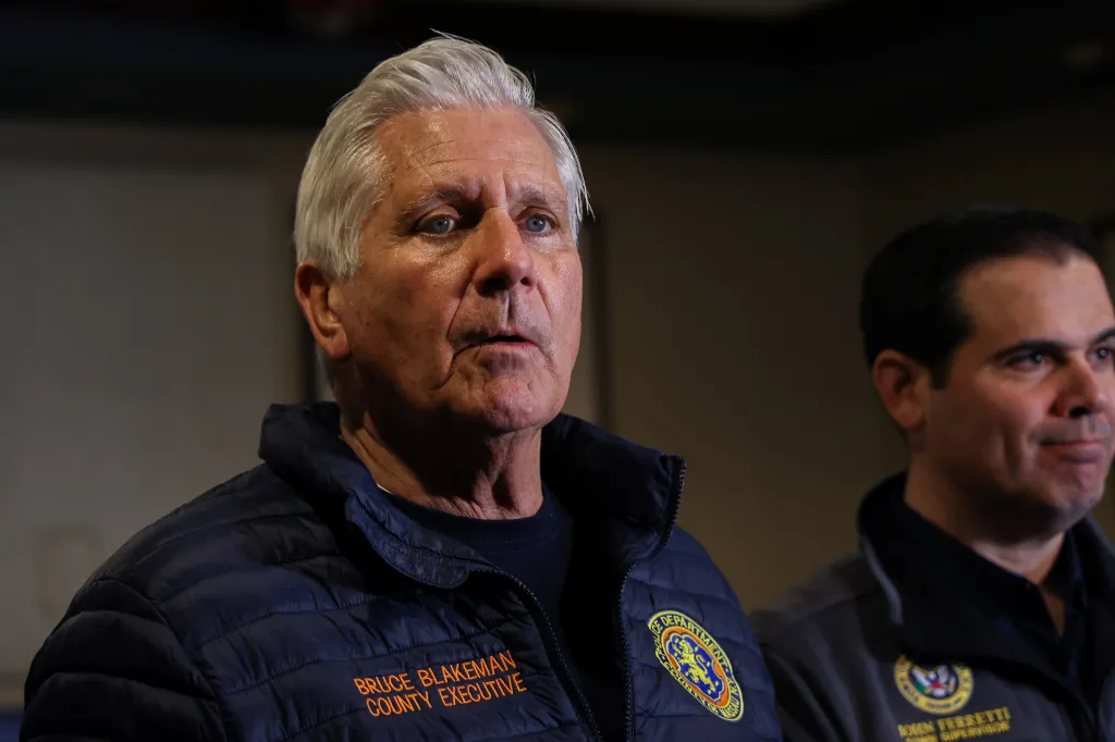 Nassau County Executive Bruce Blakeman and another man at a 