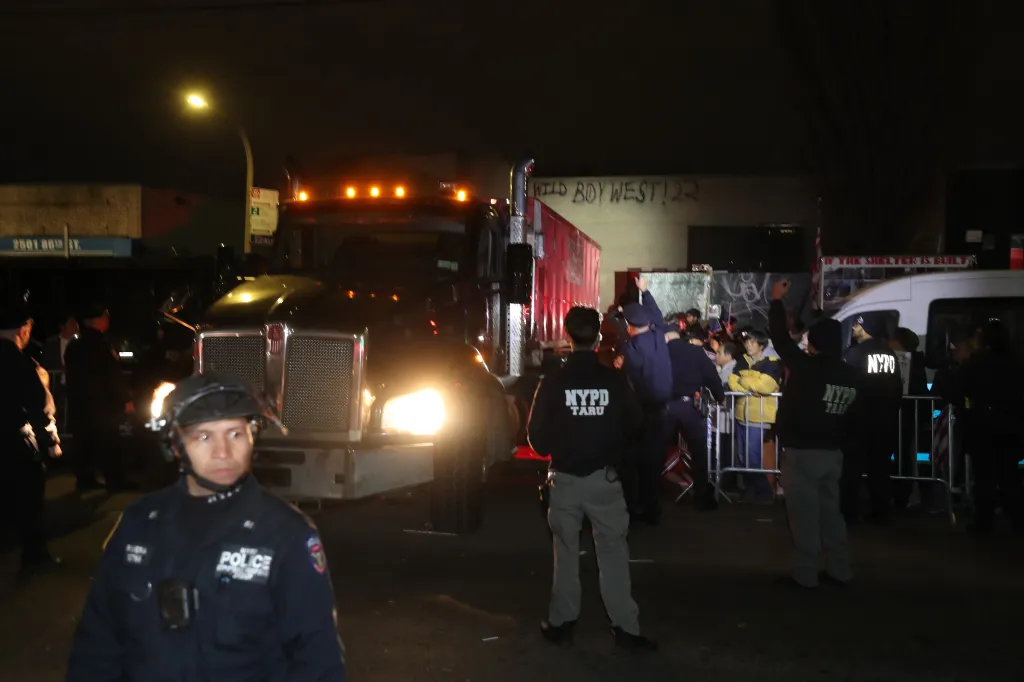 protesters tried stop a construction vehicle from entering a site of a planned homeless shelter.