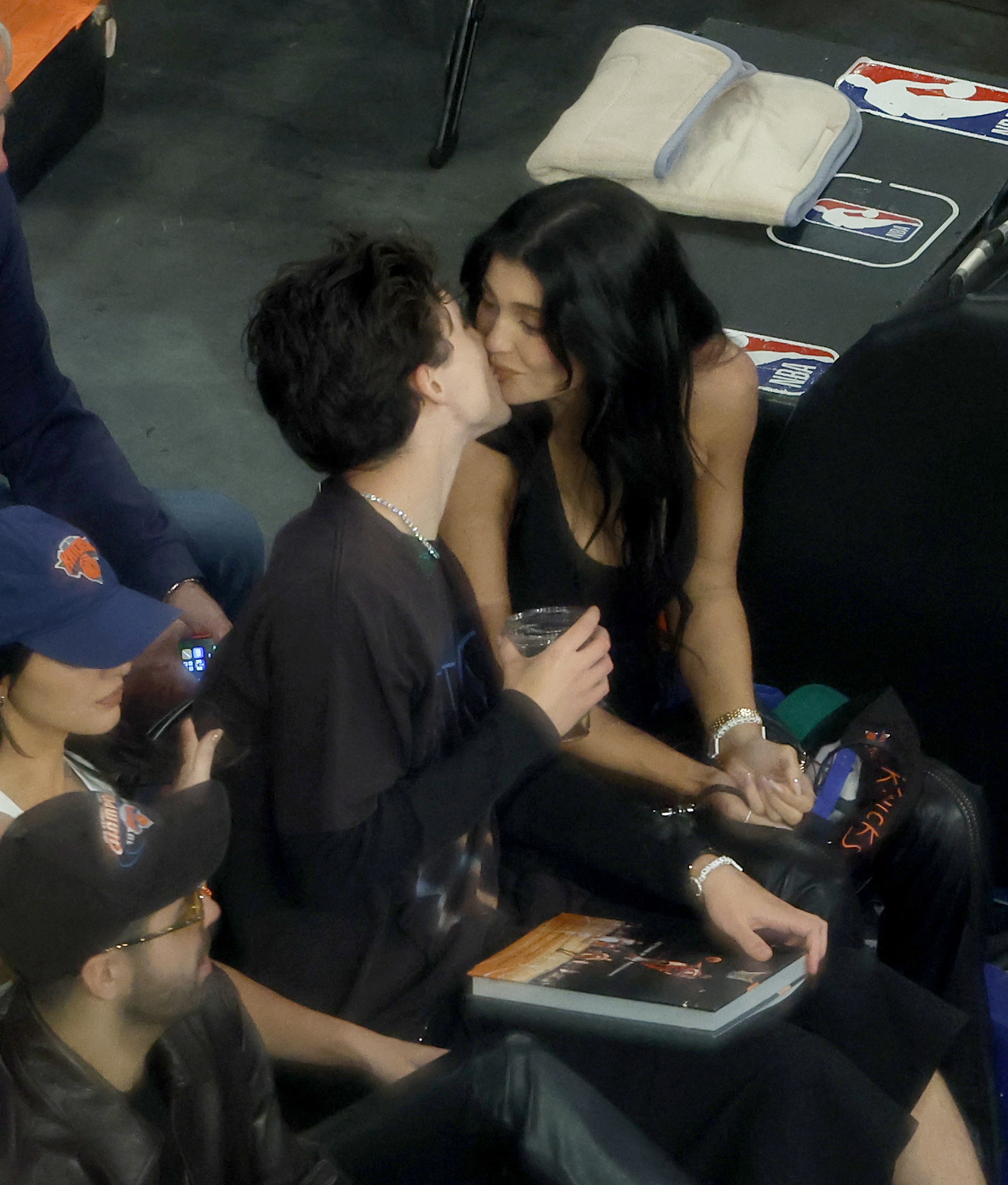Timothée Chalamet kissing Kylie Jenner during a New York Knicks vs. Boston Celtics game at Madison Square Garden.