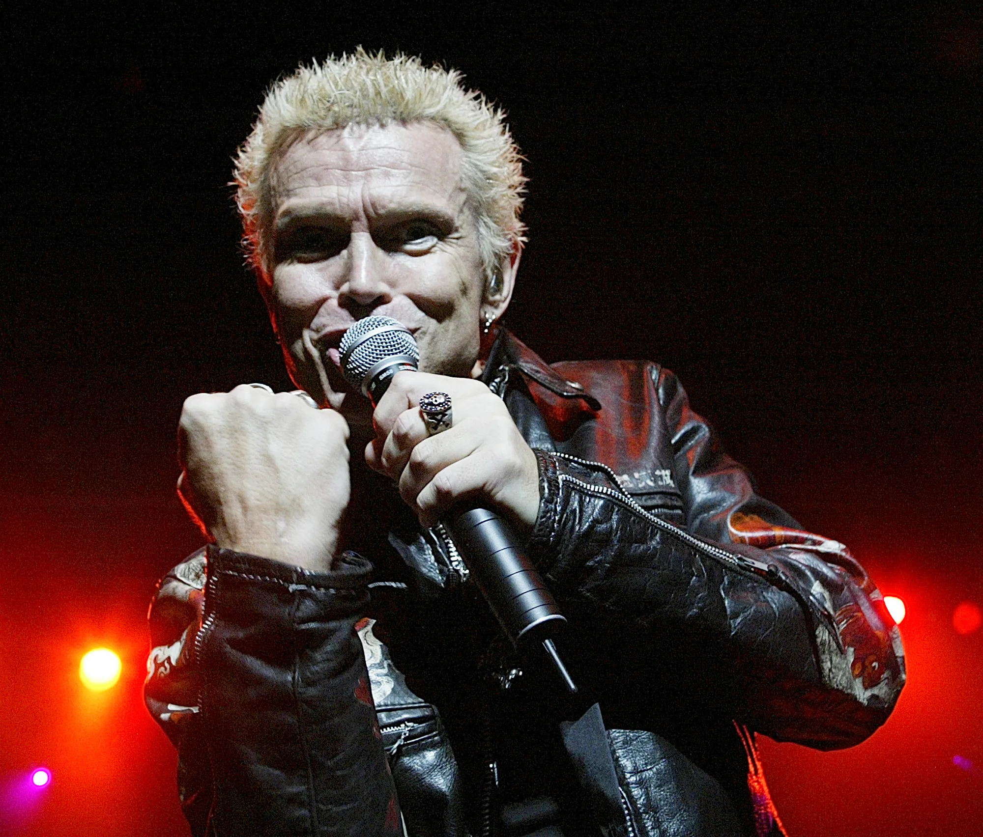 Rocker Billy Idol performing live in concert.