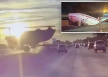 Terrifying moment runaway boat careens across traffic on major LA freeway