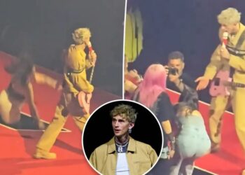 MGK fan faceplants after falling through hole in stage during wild concert moment