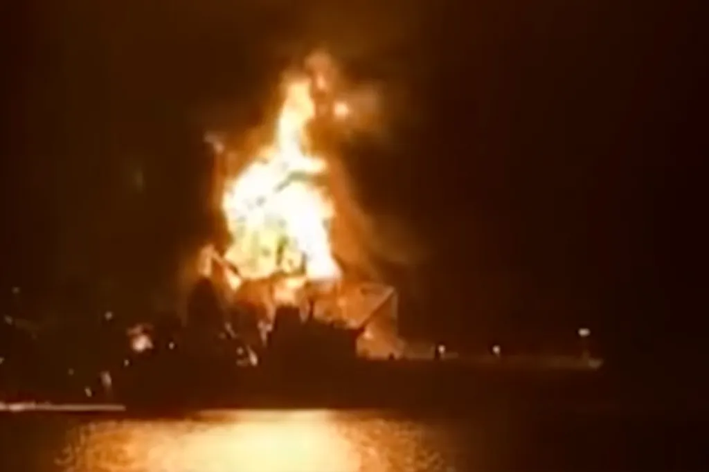 Ship on fire at night.