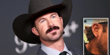 Riley Green left bleeding after fan hurls phone at country star onstage during concert