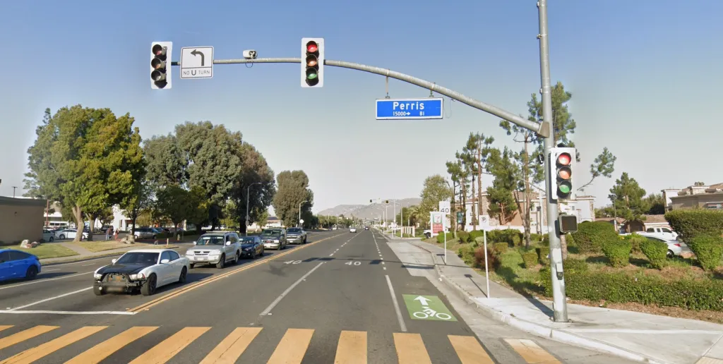 Street view of Perris Boulevard in Moreno Valley, with a sign indicating
