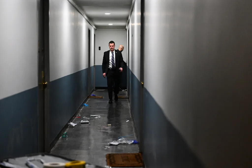 NYPD detectives investigate a fatal stabbing in a residential building hallway in Crown Heights, Brooklyn.