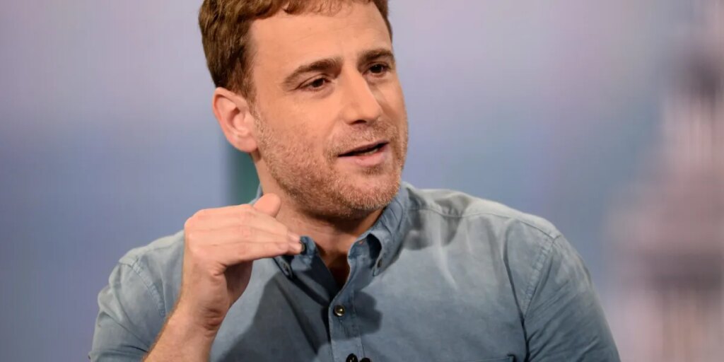 Slack cofounder says workers and CEOs can get stuck doing ‘fake’ work like pre-meetings and slide shows