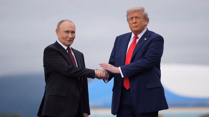 ANCHORAGE, ALASKA - AUGUST 15: U.S. President Donald Trump (R) greets Russian President Vladimir Putin as he arrives at Joint Base Elmendorf-Richardson on August 15, 2025 in Anchorage, Alaska. The two leaders are meeting for peace talks aimed at ending the war in Ukraine. (Photo by Andrew Harnik/Getty Images)