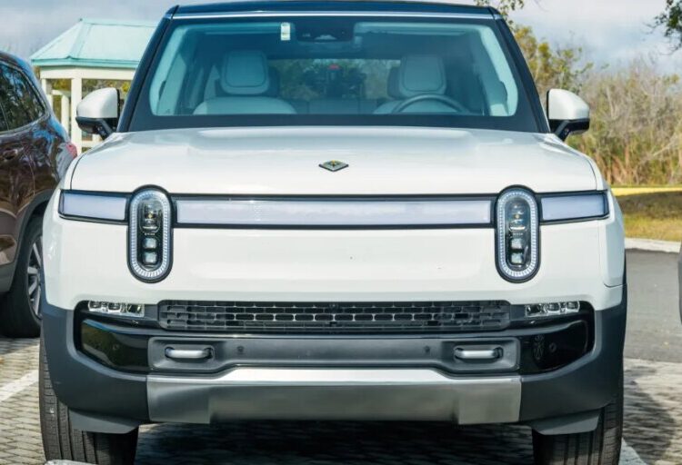 Uber will operate its own robotaxis again—this time with Rivian’s not‑yet‑built EVs