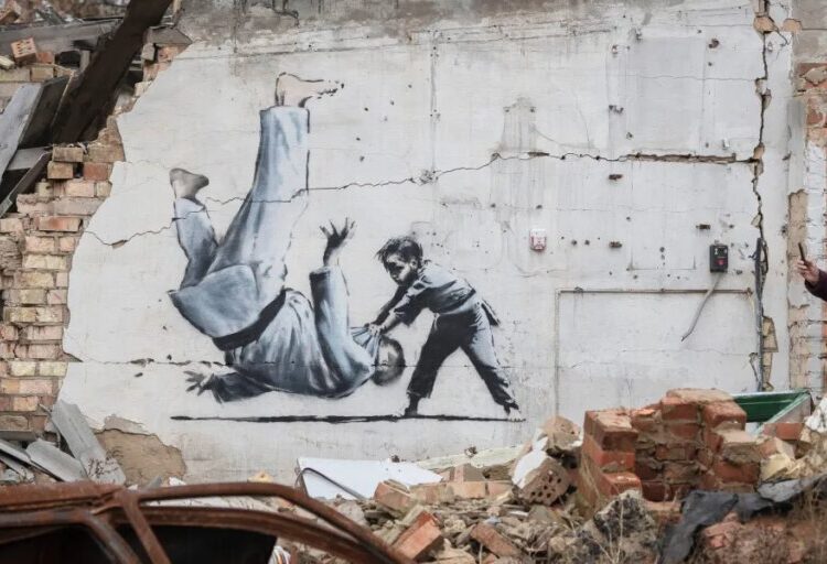 Banksy may have been identified, but his mystery has long been part of his art’s value, and a fan says it’s like finding out Santa Claus isn’t real