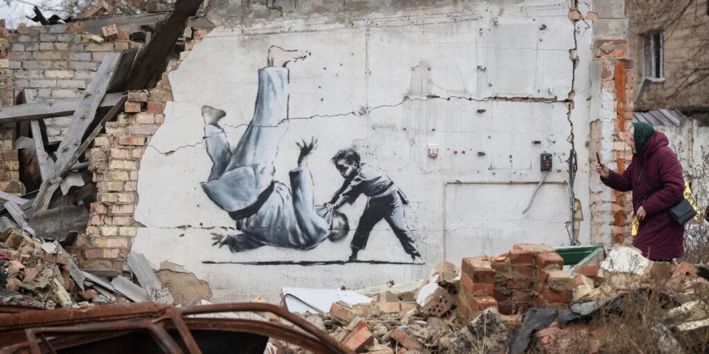 Banksy may have been identified, but his mystery has long been part of his art’s value, and a fan says it’s like finding out Santa Claus isn’t real