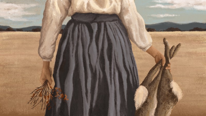 A woman holding dead rabbits