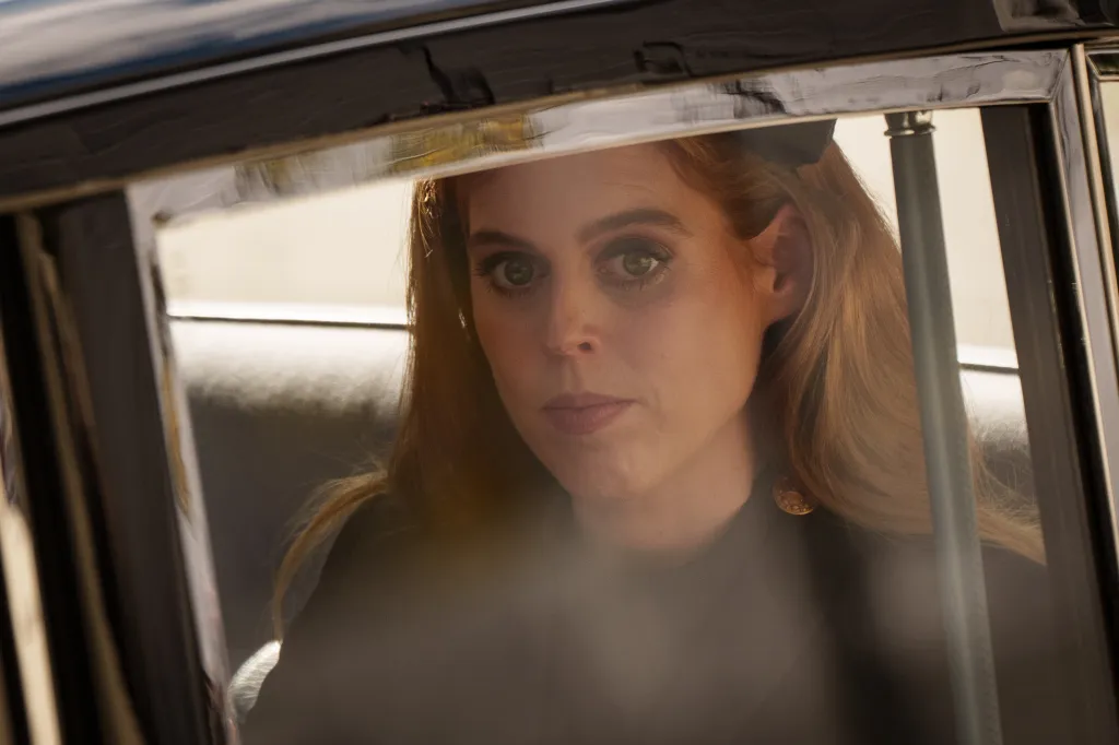 Princess Beatrice looking out of a car window.