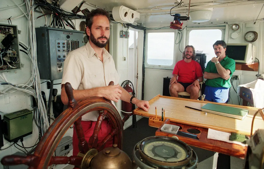 Tommy Thompson at the helm of the Arctic Explorer on Aug. 29, 1991.