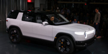 Uber to Buy Rivian Vehicles for Use as Driverless Taxis