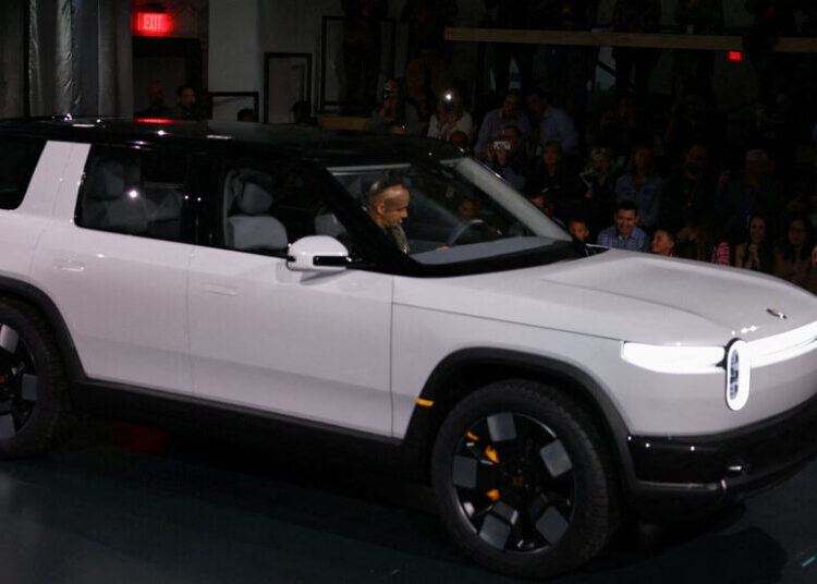 Uber to Buy Rivian Vehicles for Use as Driverless Taxis