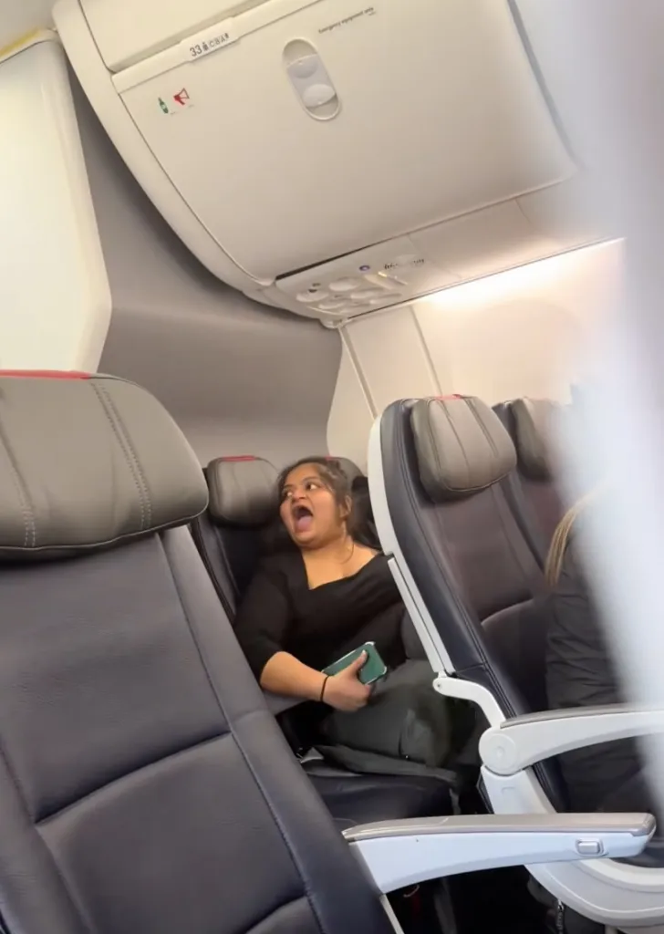 An American Airlines passenger shouts on a plane.