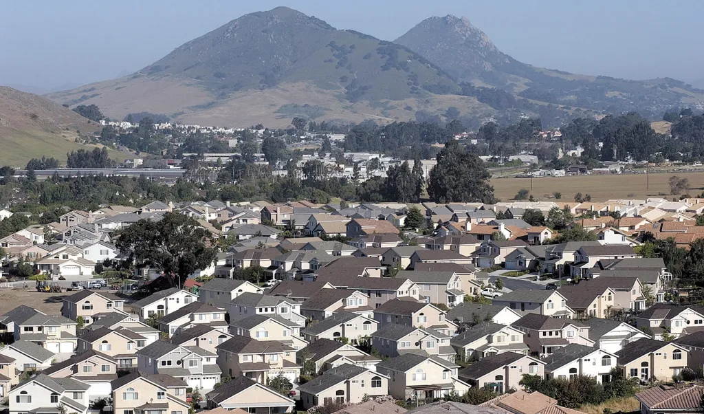 New housing developments in San Luis Obispo, California, with hills in the background.