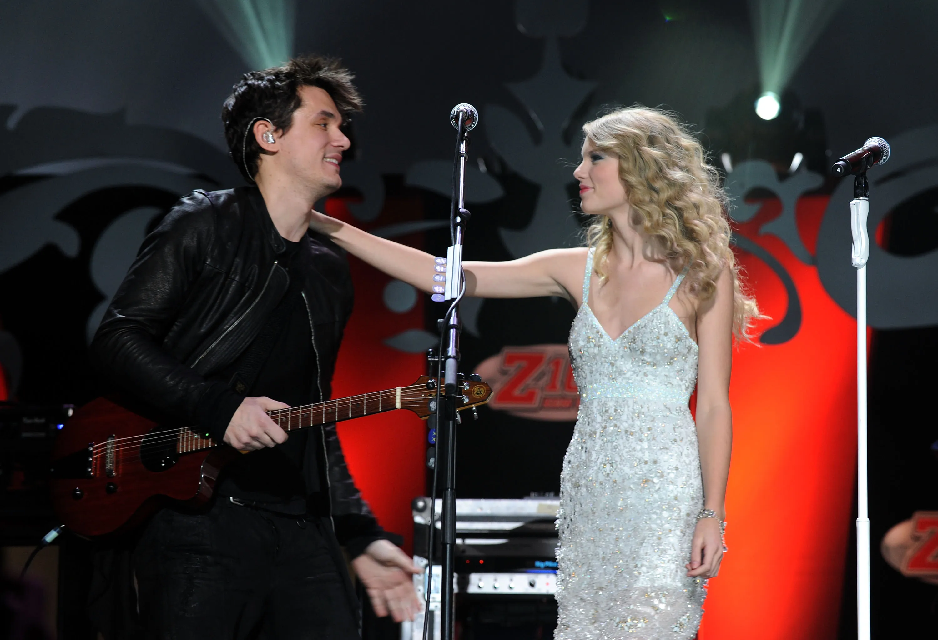 John Mayer and Taylor Swift performing on stage.