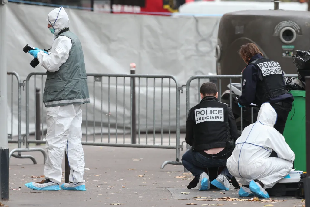 Police and forensic scientists examine an area near the Bataclan theatre in Paris after a series of terrorist attacks.