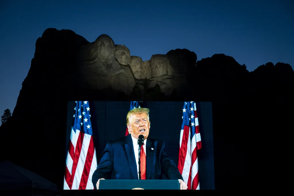 Donald Trump speaks on a screen at Mount Rushmore.
