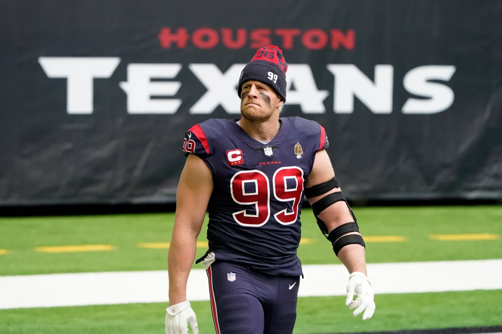 J.J. Watt walks on the field before an NFL football game against the Cincinnati Bengals.