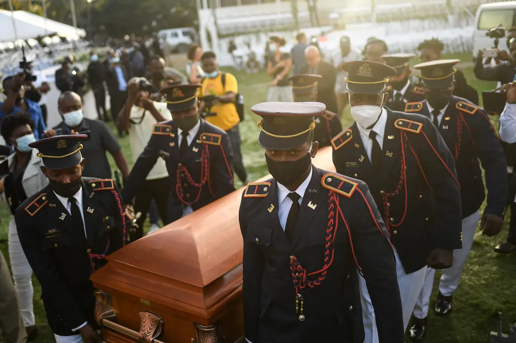 Police carry the coffin of slain Haitian President Jovenel Moise at the start of the funeral at his family home in Cap-Haitien, Haiti.