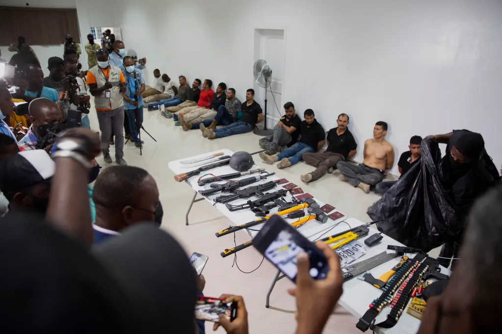 suspects in the assassination of Haiti's President Jovenel Moise are shown to the media, along with the weapons and equipment they allegedly used in the attack, at police headquarters in Port-au-Prince, Haiti on July 8, 2021.