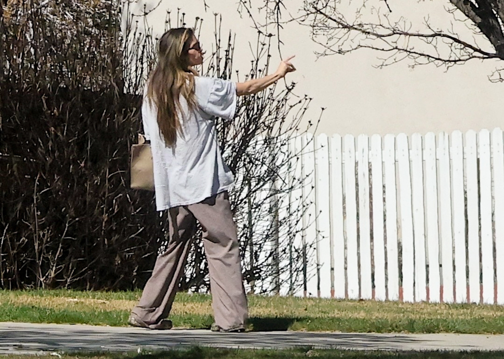 Taylor Frankie Paul in casual clothes, walking and pointing in Draper, Utah.