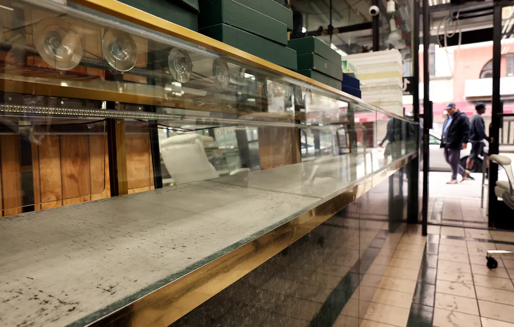 Empty jewelry display cases in a store after a theft.