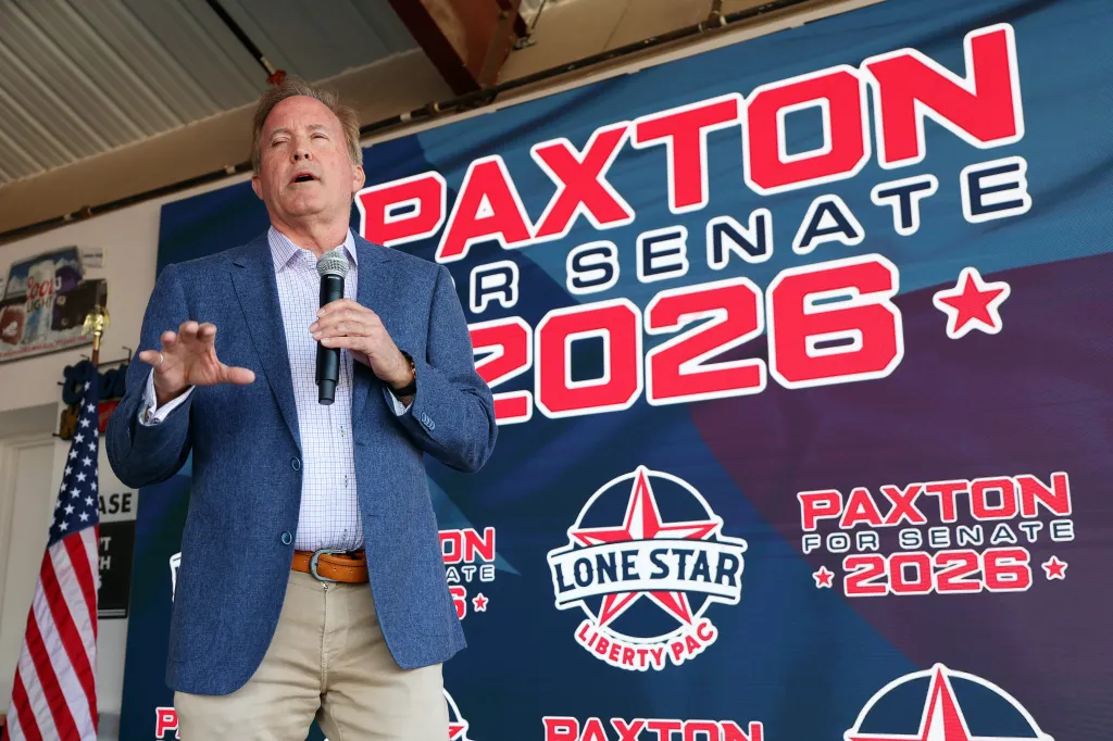 Ken Paxton campaigning for Senate in front of a