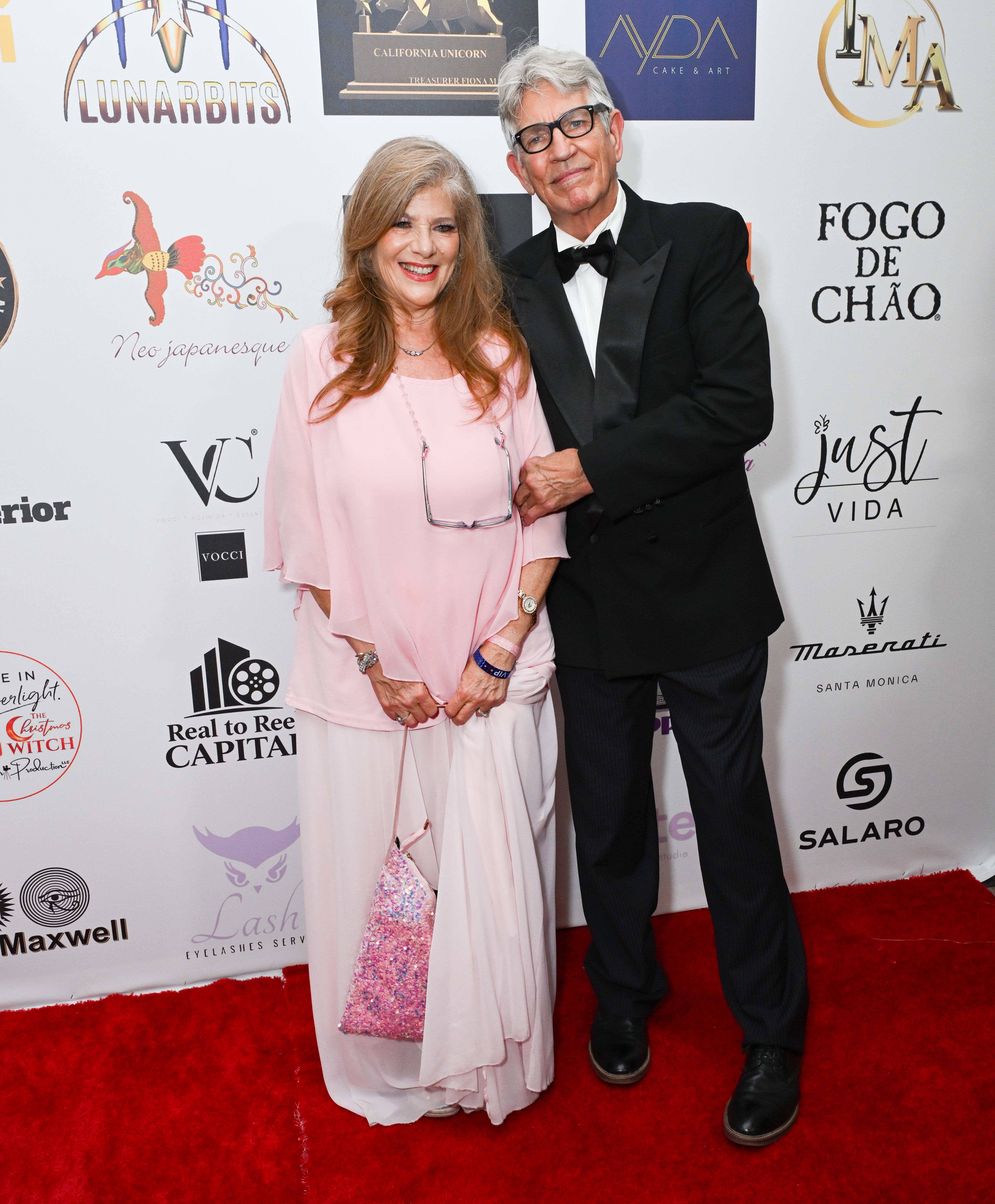 Eliza Roberts, in a light pink gown, and Eric Roberts, in a tuxedo, attend Luxury Gala 2026.