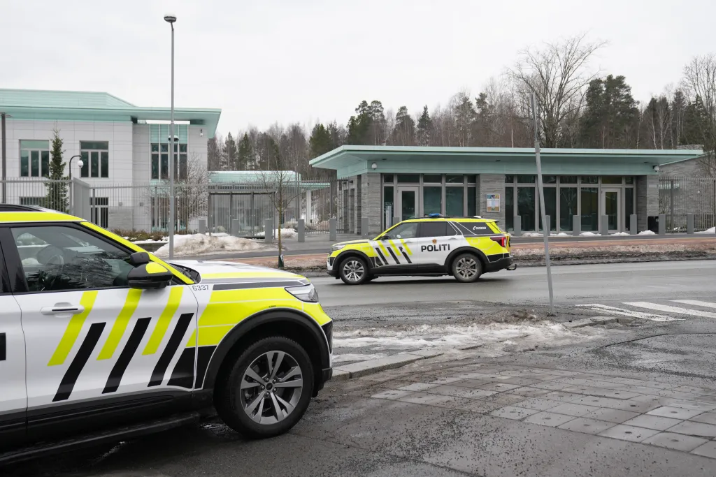 Two police cars parked outside the US Embassy in Oslo, Norway, following an explosion.