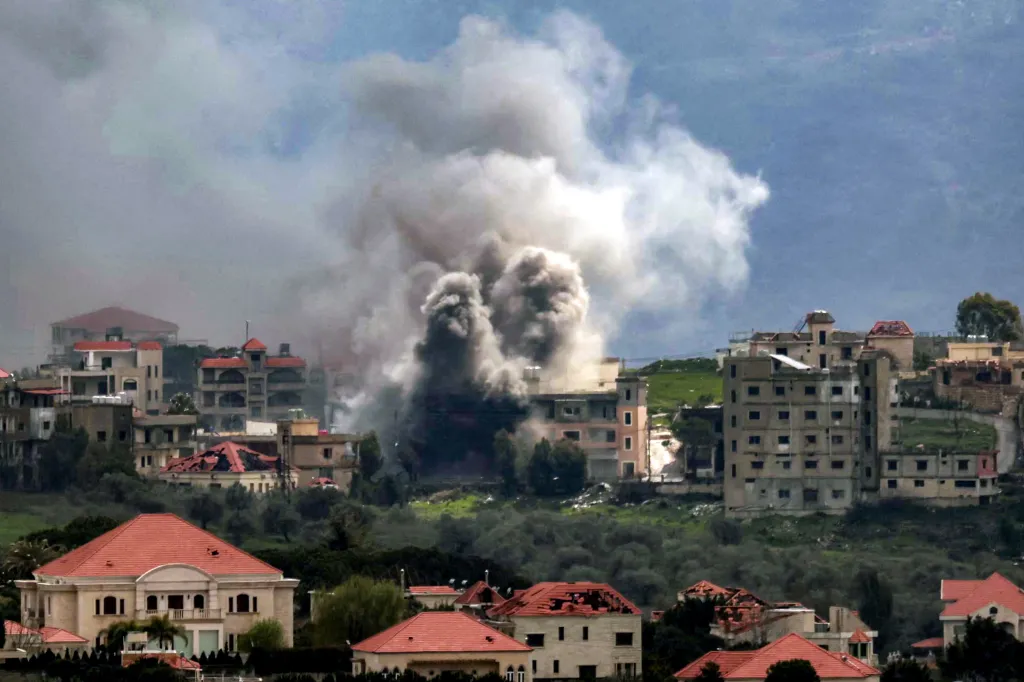 Smoke plumes rising from buildings in the village of Khiam, Lebanon, after an Israeli bombardment.