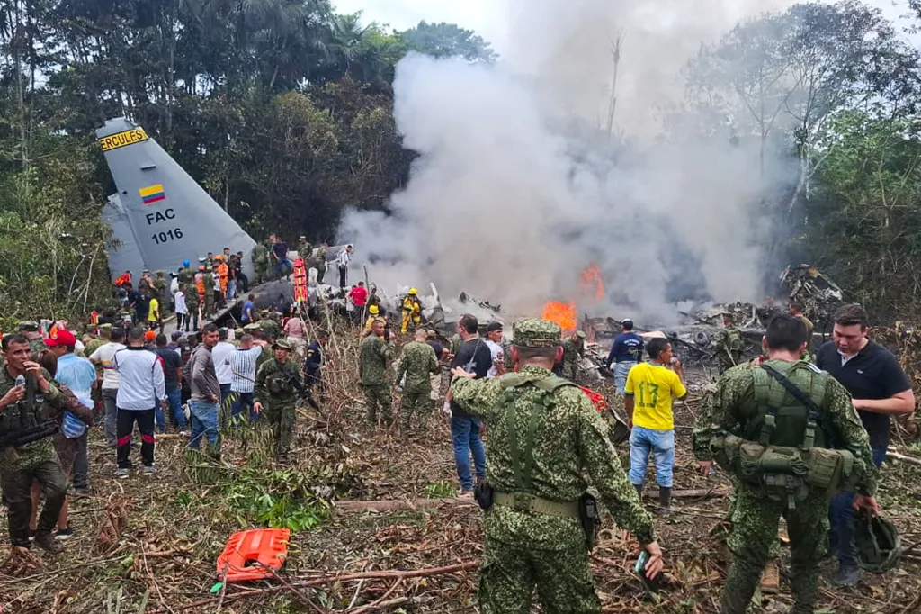 Members of the Colombian Armed Forces, rescue workers, and volunteers are conducting rescue operations at the crash site of a Colombian Air Force Hercules C-130 aircraft in Puerto Leguizamo, Colombia, 23 March 2026.