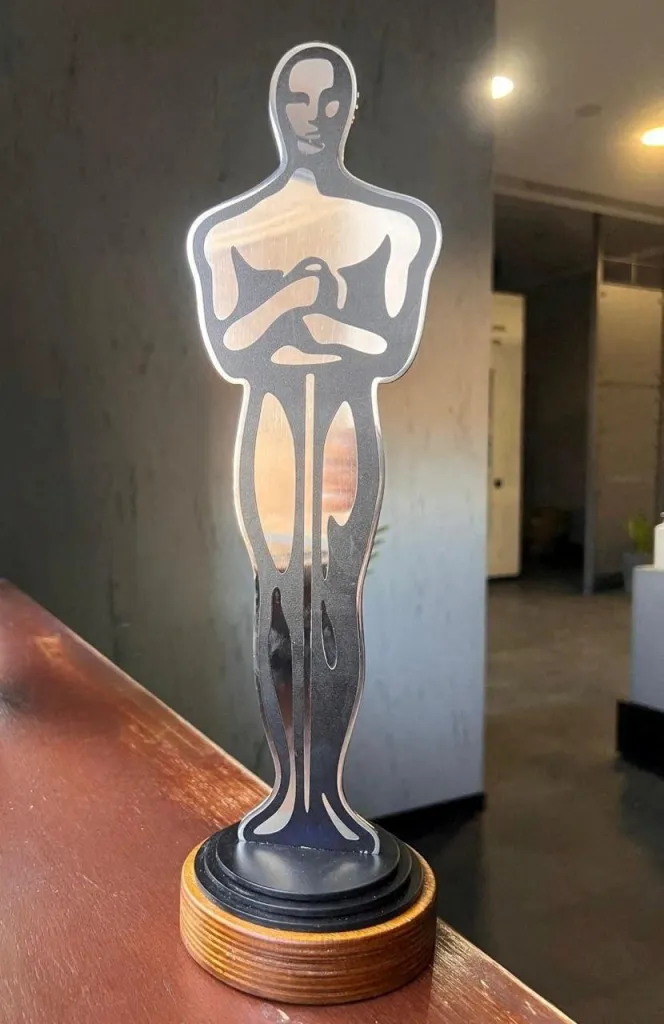 An Oscar-like award made of metal, given to actor Sean Penn.