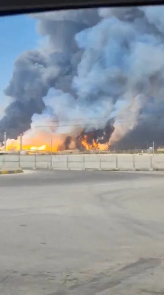 Smoke and fire rise near the South Pars gas field following an attack in Bushehr Province, Iran.