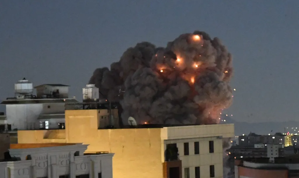Smoke and sparks rise from a building in Tehran following an explosion.