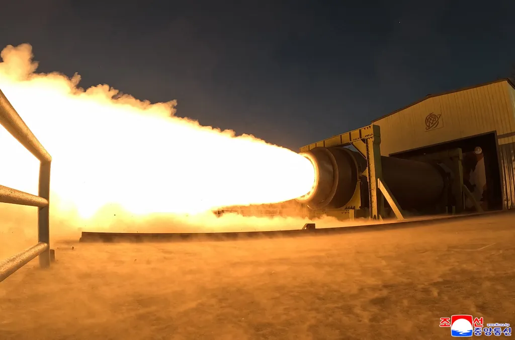 A solid-fuel rocket engine is run through a combustion test at an undisclosed location in North Korea.