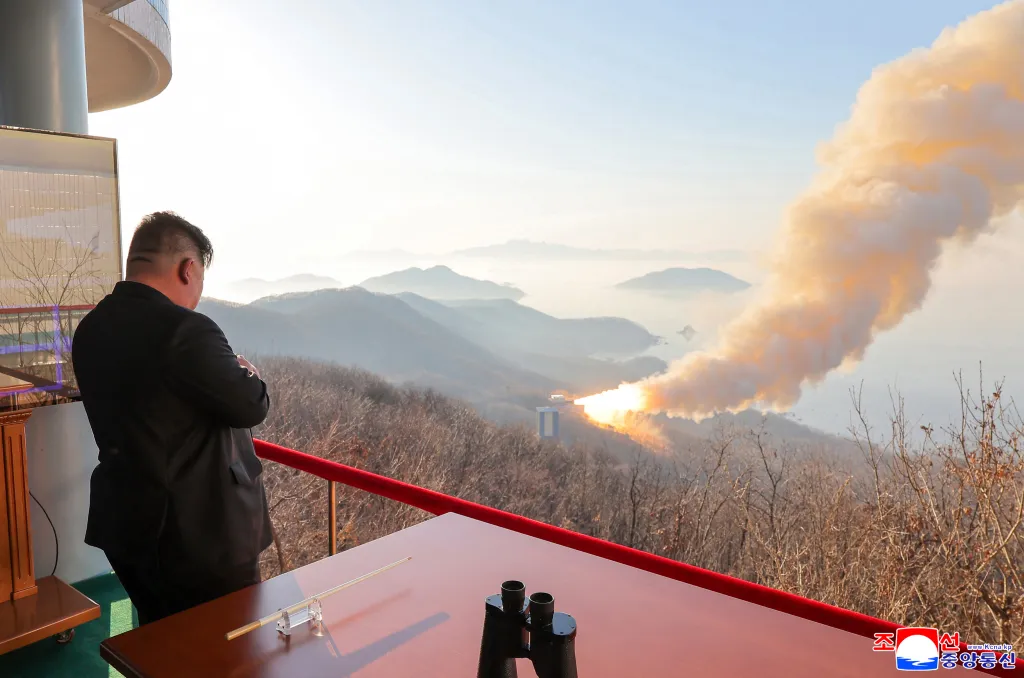 North Korean dictator Kim Jong Un watches a combustion test of a solid-fuel rocket engine in photos released on March 29, 2026.